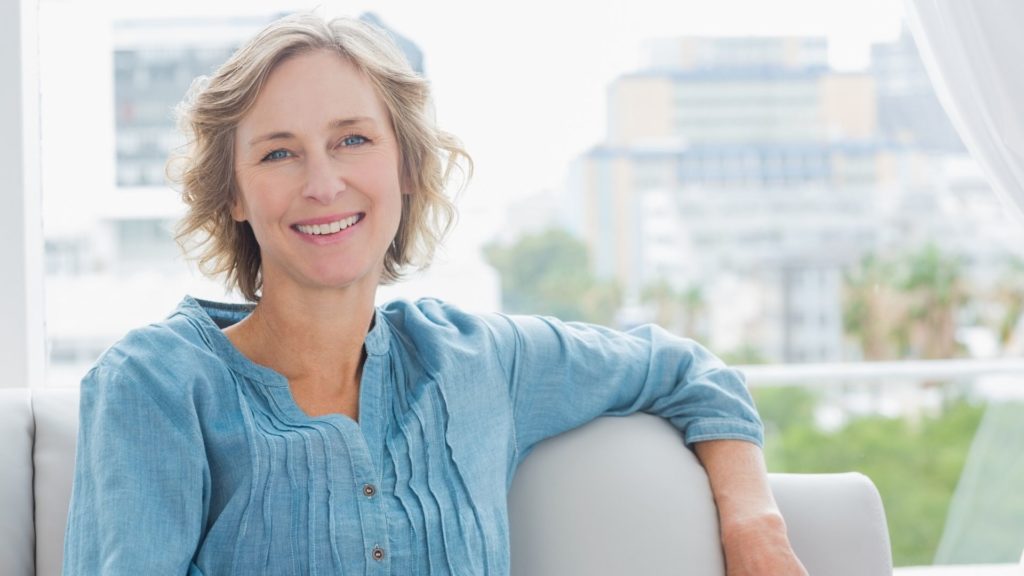 woman in her 40s wearing a blue shirt