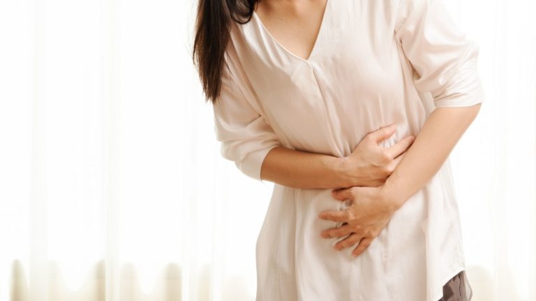 woman suffering from severe abdominal pain