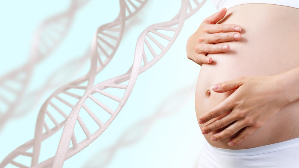 pregnant woman next to DNA strands