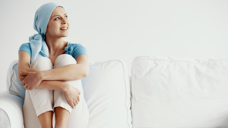 woman with cancer wearing head wrap