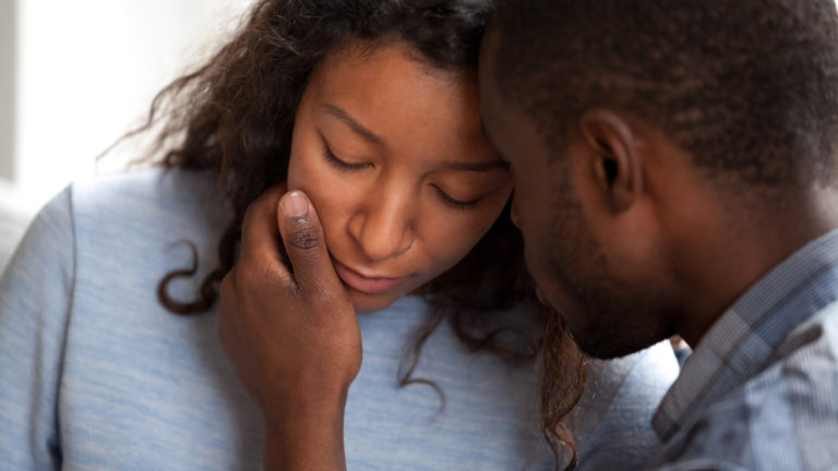 husband consoling an upset wife