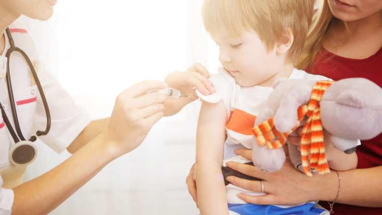 child receiving polio vaccine